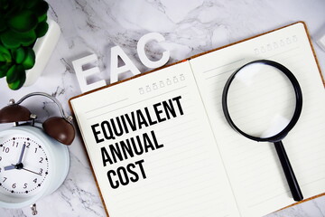 EAC - Equivalent Annual Cost acronym on notepad, Business concept background