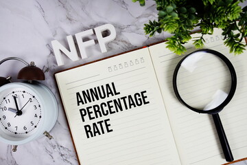 NFP - Not For Profit acronym on notepad, Business concept background