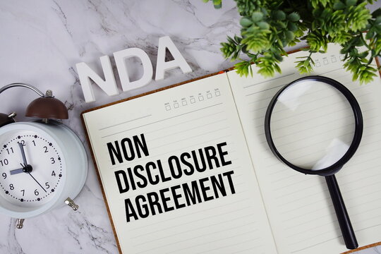 NDA - Non Disclosure Agreement acronym on notepad, Business concept background