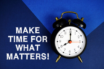 Make Time For What Matters! text with alarm clock on blue background
