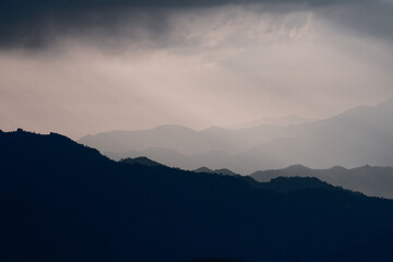 Moody Mountain Layers in Sunset