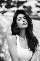 Black and white portrait of a Thai girl in the park