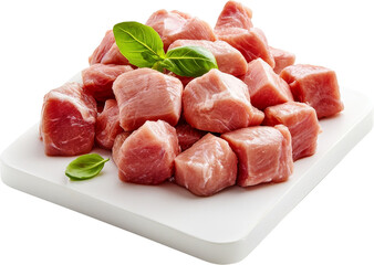 Raw beef cubes with green garnish on a cutting board. Raw material.