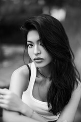 Black and white portrait of a Thai girl in the park