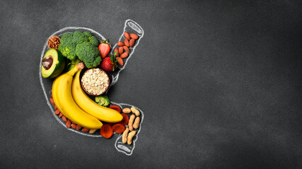 Healthy diet for human stomach: oatmeal, flax, banana, green broccoli, fresh avocado and other healthy vegetables and fruits. Healthy food clean eating selection.