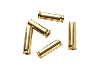 a group of brass bullet shells on a white surface