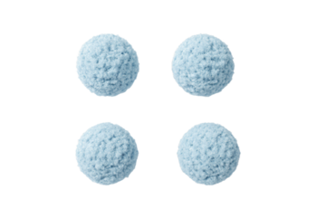 a group of balls of yarn on a white surface