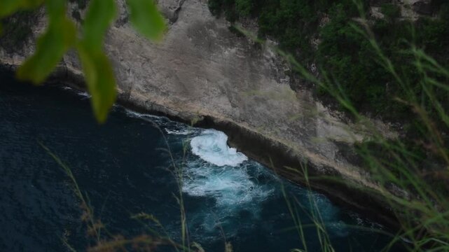 small waves crashing on the coral of Nusa Penida