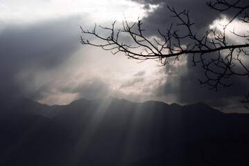Sun Rays Breaking Through Clouds at Dusk