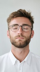 Obraz premium Serene Caucasian man meditating, embracing tranquility, World Meditation Day, Zen mindfulness, face of peaceful introspection