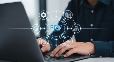 Entrepreneur implementing ERP system on laptop, enterprise resource planning software for business management