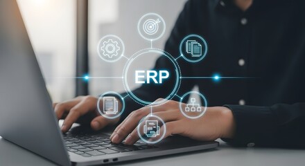 Executive using laptop for ERP system, enterprise resource planning, showing efficiency and data flow with modern technology integrations