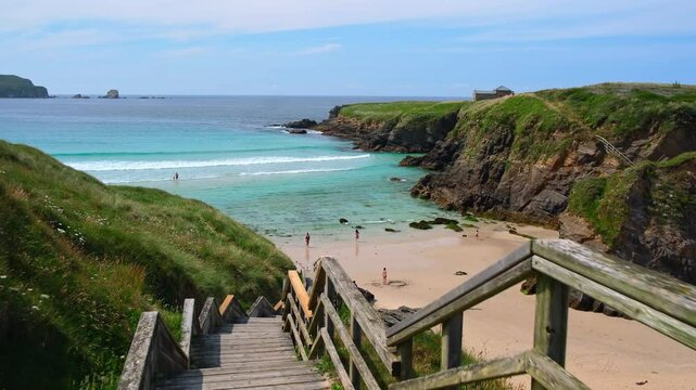 Revealing view of Playa de Santa Comba beach with turquoise sea in Galicia Spain