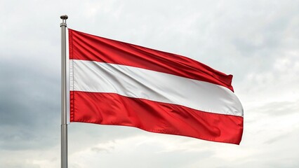 The austrian flag waves proudly against a cloudy sky