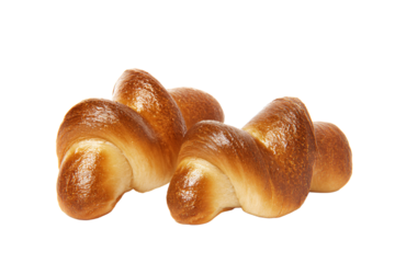 a group of croissants sitting on top of a white surface