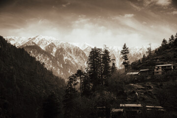 Small Village with Snowy Mountain in Background