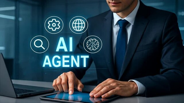 Business man in suit uses tablet at desk with laptop nearby; glowing ai agent text and icons float in foreground of sleek, cool toned workspace showing smart technology, ai interface
