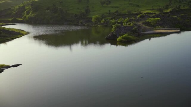 Spectacular view of Alsigarh Lake in Rayta Hills, with a beautiful reflection in the water. Udaipur, Rajasthan, India.