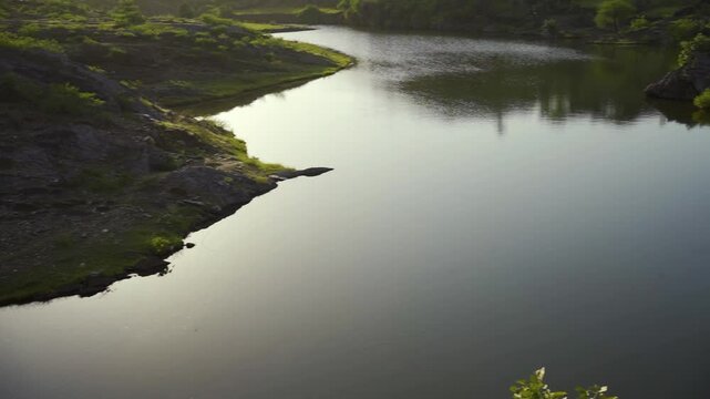 Spectacular view of Alsigarh Lake in Rayta Hills, with a beautiful reflection in the water. Udaipur, Rajasthan, India.