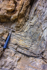 Geological Anticline Fold with Hammer