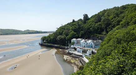 Fototapeta premium Portmeirion village nestled in woodland on the estuary of the River Dwyryd in North Wales.