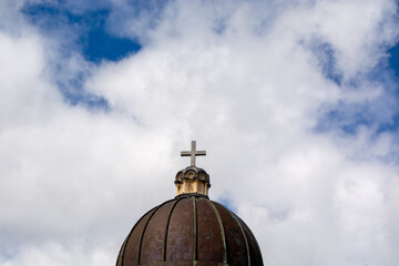 Dome with Cross Against Blue Sky