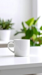 White mug on white table, plants in background (1)