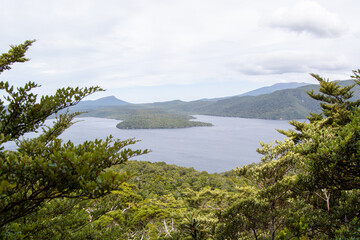 Tranquil Lake Surrounded by Lush Mountains