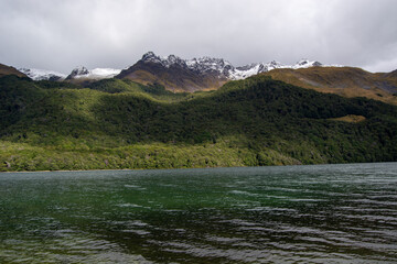 Serene Lake Surrounded by Lush Mountains