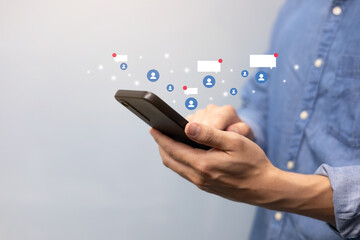 close up young man hand hold smartphone and use social media application to connect and talk with friend or follower for modern lifestyle and technology trend concept