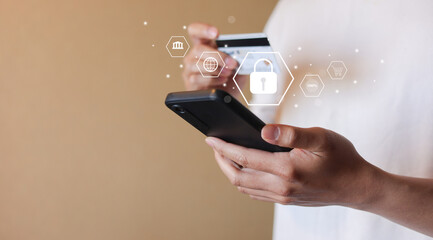 young man hand hold smartphone and using internet for online shopping on marketplace and make a payment by credit card with cyber security system for lifestyle technology and cyber security concept