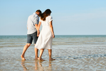 A couple walking on the ocean