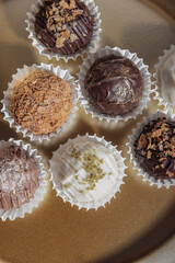 Handmade chocolates or cheese truffles. Vertical
