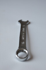 metal wrench with size marking 13 on a white background, ideal for themes like repair, mechanics,...