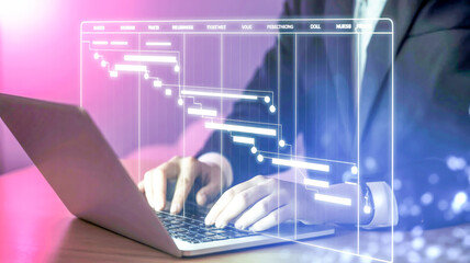 Person using laptop with digital Gantt chart interface