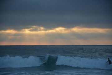 surfing at sunset in portugal
