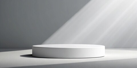 Minimalist white podium with dramatic light and shadow on a grey background