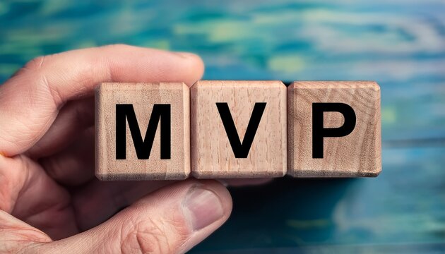 wooden cube in hand with the letter from the mvp word
