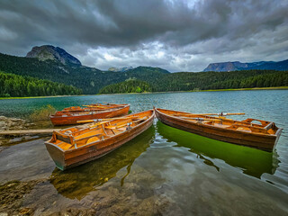 Wooden boats on a mountain lake, Black Lake, Durmitor, Montenegro