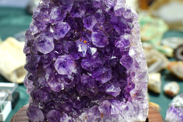 Beautiful Brazilian violet amethyst druse at a rock show. Healing chakras. Amethyst quartz crystals.