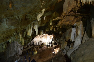 Inside of beautiful old dark cave with many stalactites. Grotte di Is Zuddas, Italy, Sardinia