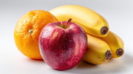 Colorful Arrangement of Fresh Fruits Including Orange, Banana, and Apple on Neutral Background
