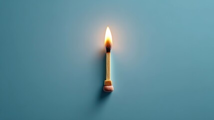 Burning matchstick on teal background