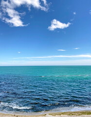 Obraz premium It is useful and pleasant to breathe fresh sea air in spring while walking along the sandy beach of the Odessa coast.