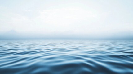 Obraz premium Serene Lake with Soft Ripples Under a Calm Sky