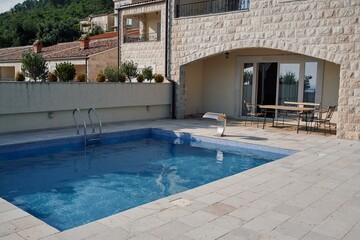 Stylish stone villa with pool and patio in serene hillside setting