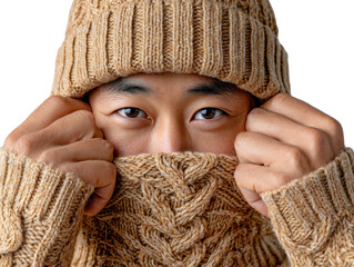 Cozy Comfort: A person wrapped in a warm, cable-knit sweater and hat. The close-up captures their eyes, revealing the essence of winter tranquility.