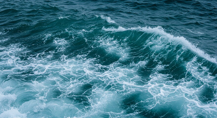 Dynamic ocean wave with foam crest, conveying powerful natural force and turbulent beauty on open