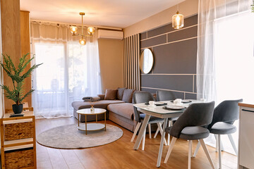 Modern minimalist living room with stylish furniture and elegant lighting