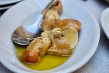 Typical starter with muhrooms in olive oil from Italy Maremma area
